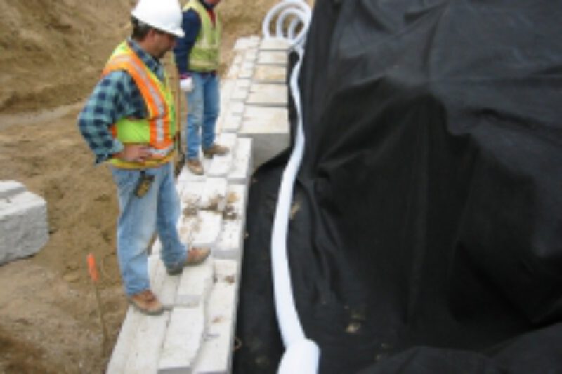 03 retaining wall drain tile install with filter fabric